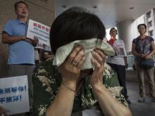    MH370  , .  2015 . Getty Images. : .